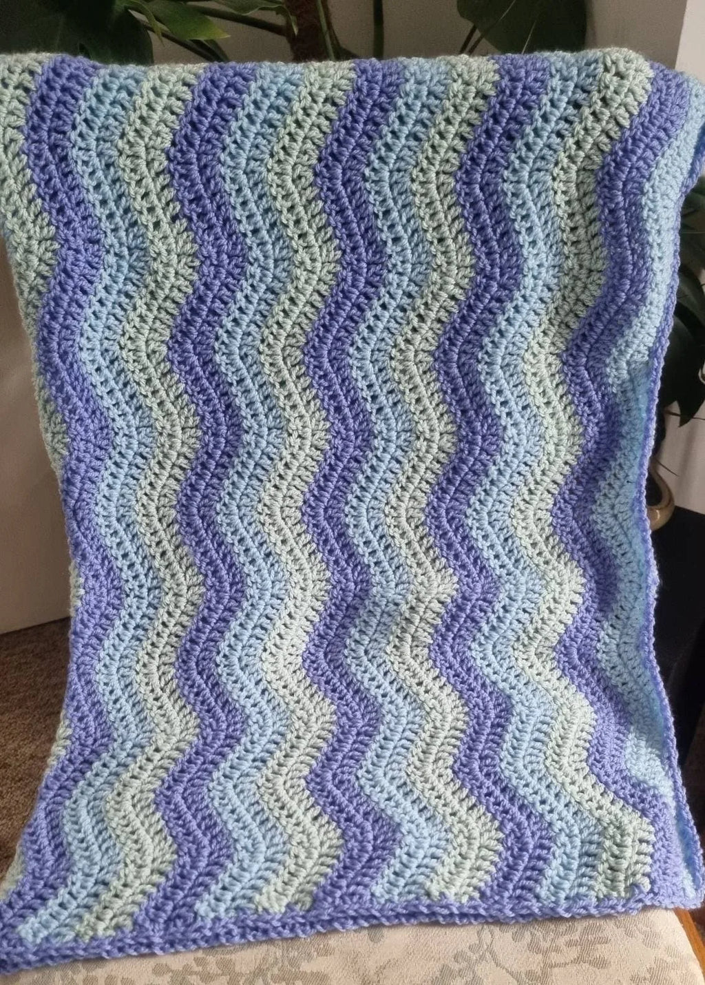 Hand crochet ripple blanket in tones of blue
