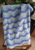 Hand crochet ripple blanket in tones of blue