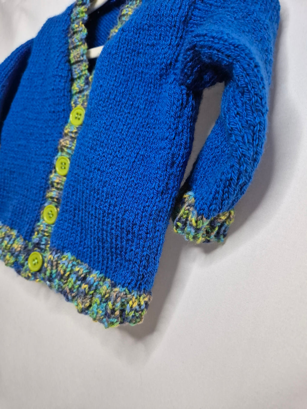 Hand Knitted baby cardigan, royal blue with scalloped edging