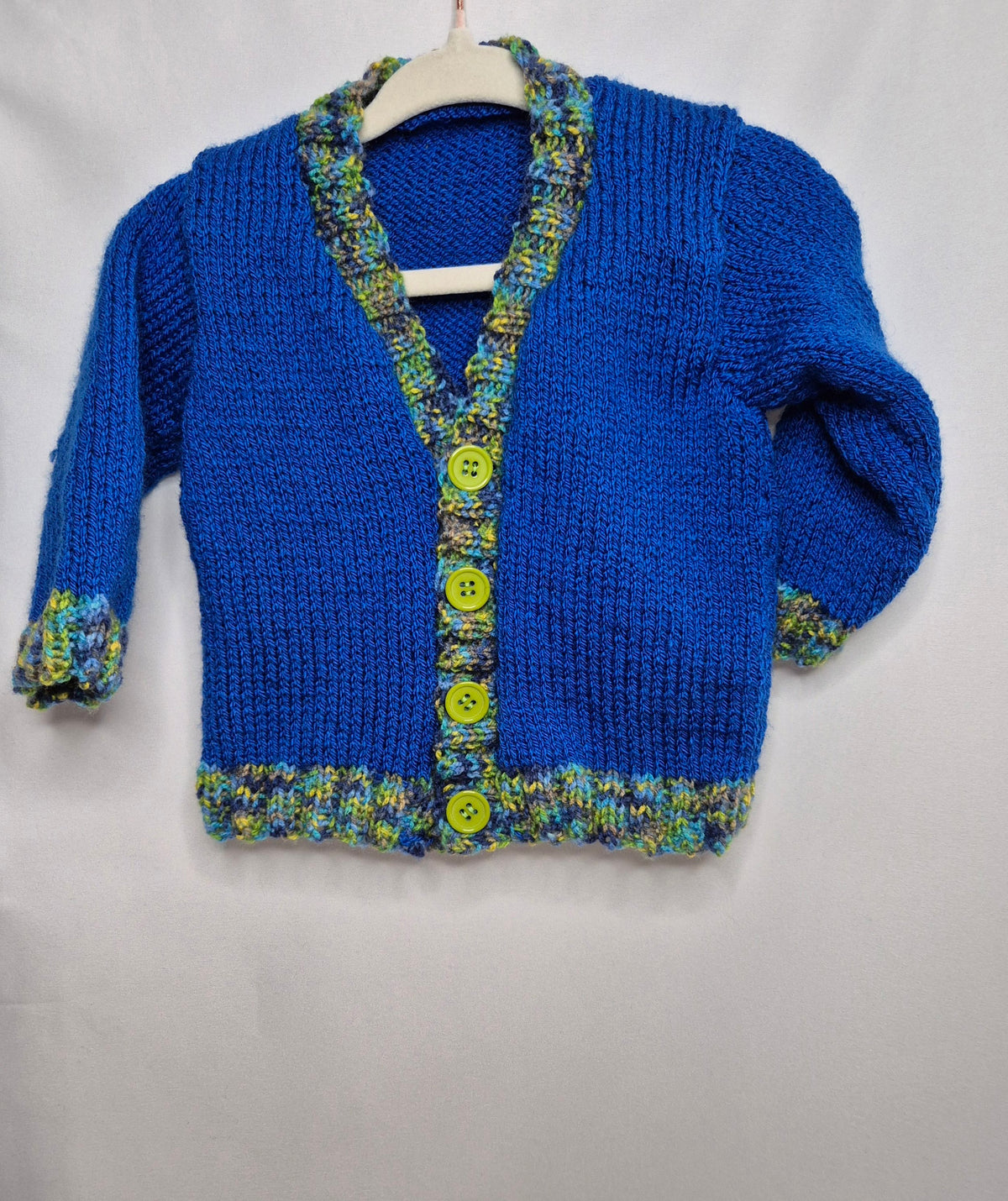 Hand Knitted baby cardigan, royal blue with scalloped edging