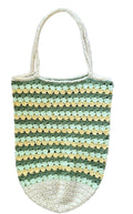 A handmade crocheted tote bag with horizontal stripes of sage green, light green, and pale yellow, featuring cream-colored handles and bottom trim, laid flat on a textured white blanket.